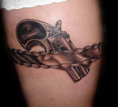 Tattoos of Guns sure look mighty pretty on a nice lil thigh doncha think