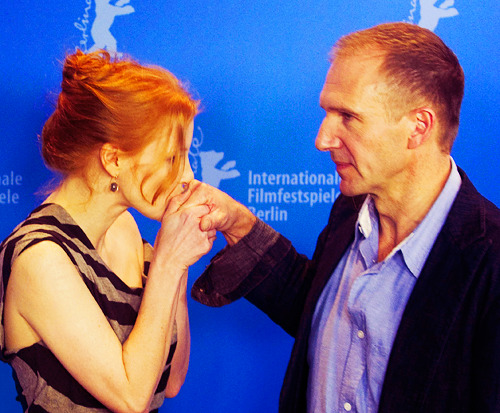 Jessica Chastain kissing Ralph Fiennes' hand at the Coriolanus photocall at