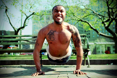 WORK OUT &#8212; Euclid resident Quavez Pollard pumps out his 246th pushup of the afternoon at Public Square in downtown Cleveland on March 21, 2012. Pollard, who sells subscriptions for The Plain Dealer, completed his fifth set of 50 pushups and growled, &#8220;I&#8217;ve got six more sets.&#8221; Photo by Brandon Blackwell @CapturedCLE