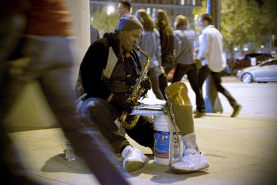 SAX IN THE CITY &#8212; Musician and amputee Samad Samad plays the saxophone outside Quicken Loans Arena in downtown Cleveland on April 3, 2012. Samad, a Cleveland native and self-taught saxophonist, removes his prosthetic leg while playing and uses it to collect donations from passers-by. &#8220;I like the reception I get,&#8221; Samad said. &#8220;I like that people say they appreciate the music.&#8221; Photo by Brandon Blackwell @CapturedCLE