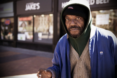PANHANDLE &#8212; A man takes a break from panhandling to pose for a photo at the corner of Ontario Street and South Roadway in downtown Cleveland on April 4, 2012. The man refused to give his name without payment. Downtown Cleveland Alliance Director of Operations and Advocacy Mark Lammon says that many panhandlers in downtown Cleveland are not homeless and make their living by asking others for money. For those who wish to help the homeless in Cleveland, Lammon suggests donating money and goods to known organizations instead of giving at the street level.  Photo by Brandon Blackwell @CapturedCLE