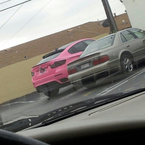 A pink BMW at Mcdonalds pink