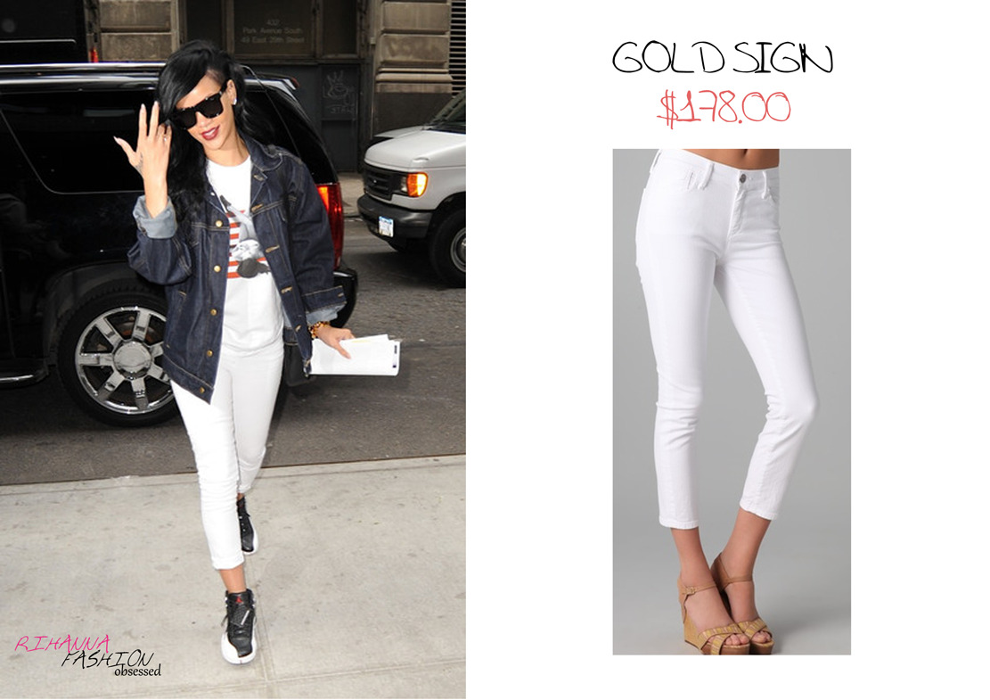 Rihanna seen arriving at her Hotel in New York in a dark oversized denim jacket with a pair of white Goldsign thrill cropped skinny jeans for $178.00. Click HERE to view item