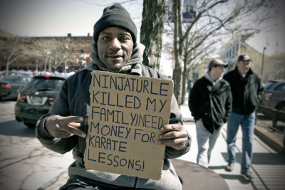 TURTLE POWER &#8212; A man creatively panhandles near Progressive Field in downtown Cleveland on April 5, 2012. The man&#8217;s humorous plea for donations did not garner much attention from passers-by. Photo by Brandon Blackwell @CapturedCLE