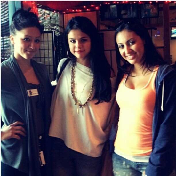 
Selena Gomez with a fan
