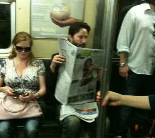 "This guy reading the newspaper on the subway is Keanu Reeves.He is from a problematic family. His father was arrested when he was 12 for drug dealing and his mother was a stripper. His family moved to Canada and there he had several step dads.He watched his girlfriend die. They were about to get married, and she died in a car accident. And also before that she had lost her baby. Since then Keanu avoids serious relationships and having kids.He’s one of the only Hollywood stars without a Mansion. He said: ‘I live in a flat, I have everything that I need at anytime, why choose an empty house?’One of his best friends died by overdose, he was River Phoenix (Joaquin Phoenix’s brother). Almost in the same year Keanu’s father was arrested again. His younger sister had leukemia. Today she is cured, and he donated 70% of his gains from the movie Matrix to Hospitals that treat leukemia.In one of his birthdays, he got to a little candy shop and bought him a cake, and started eating alone. If a fan walked by he would talk to them and offer some of the cake.He doesn’t have bodyguards, and he doesn’t wear fancy clothes.When they asked him about ‘Sad Keanu’, he replied: ‘You need to be happy to live, I don’t.’"