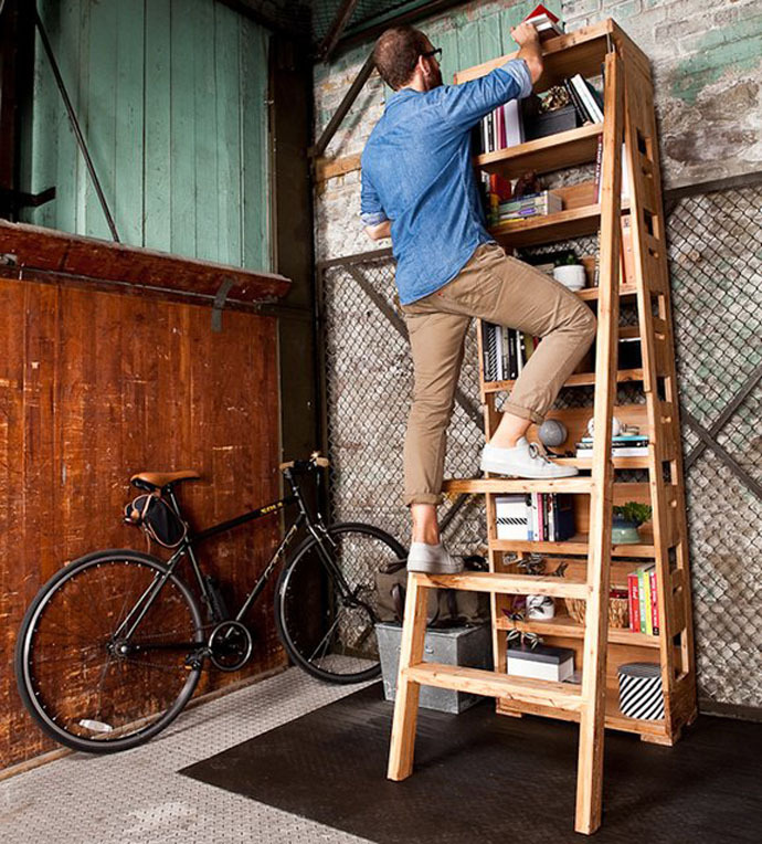 Book-casing 
We found this piece of furniture and thought it to be quite practical. Storing books in a beautiful way while having a ladder available. No more standing awkwardly on selves, while trying to fetch a book. Just use the ladder…
(via DesignRulz | Smart Bookcase Features a Ladder That Pulls Out Immediately)