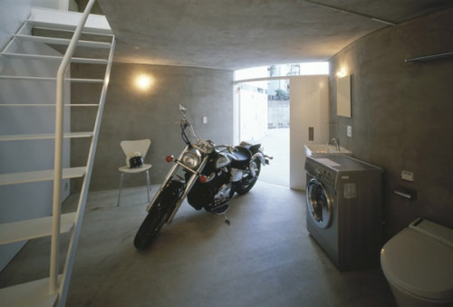 Original Motorcycle-Friendly Apartment Building in Tokyo

This unusual motorcycle-friendly apartment building in Tokyo is the result of a design collaboration between Akiyoshi Takagi Architects, Nakae Architects and Ohno Japan- it wouldn’t come as a surprise if all these three companies shared a common interest. Structured on three levels and consisting of eight separate homes, the project was especially developed with adventure in mind, and when we say adventure, we mean the endless passion for the road shared by its inhabitants. Each of the eight housing units has its own built-in garage space to store the roaring motorcycles. The building itself is defined by concrete and was envisioned around a central courtyard. Its innovative architectural design ensures plenty of space for each apartment, not to mention room for the wheelers to ride a bit and make a complete turn. Talk about cool exclusive buildings!

