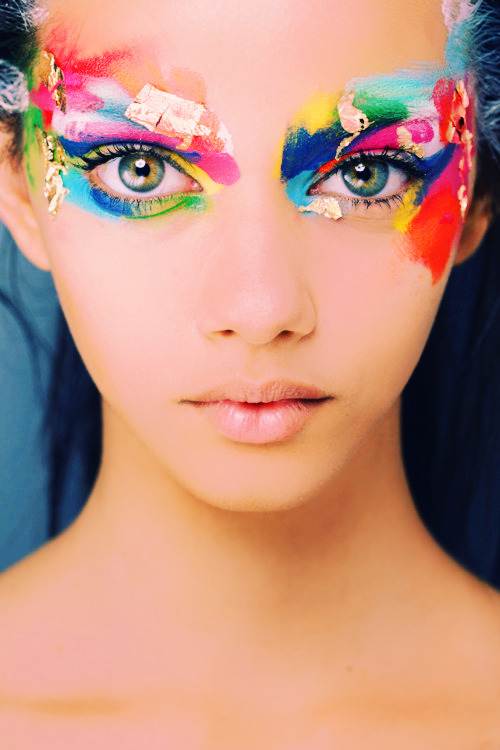 Beautiful girl with creative glitter makeup, sparkles 
