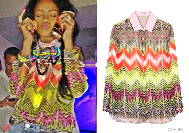 Rihanna in good spirits enjoying a night out with friends in a club in Italy. She was spotted wearing a colourful silk printed detailed blouse by french label Carven available for $385.00 (aprox. £246.00) from mytheresa.com. 