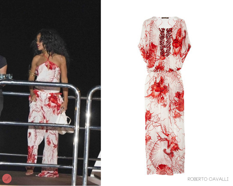 Rihanna spotted returning from a dinner with close friends in Positano, Italy. She wore a coral print halter neck top with matching bottoms both by designer Roberto Cavalli (image is an example). We could only find her top which is available for $246.00 from neimanmarcus.com. Her outfit especially the shell prints very much compliments where she is in the Mediterranean. You may also spot her holding her Prada  platform heels in white available from saks.com in black for $750.00.
Update: you can find the buttoms from mytheresa.com