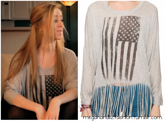 This is the american flag top that Liz wears in their February (watch the video here)You can buy the top HERE for $15.80 from Forever 21
