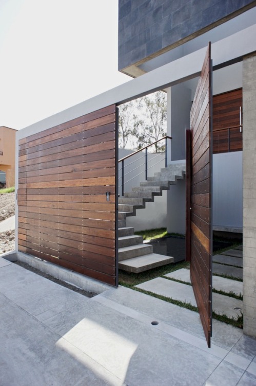 PH3 House by T38 studio
Closing itself to the street for privacy, the back of the house opens itself to the patio, creating indoor/outdoor living space.