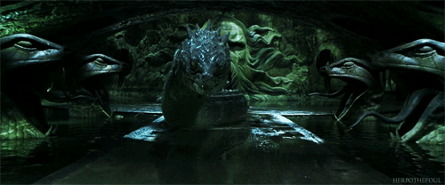 The Basilisk, opening its mouth wide as it rushes through the chamber of secrets toward the viewer, until it takes up nearly the whole image
