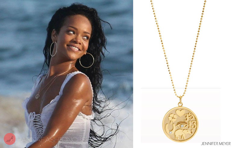 Rihanna during a campaign shoot last week in sunny Barbados wearing pieces by Jennifer Meyer. She wore a gold and diamond good luck charm pendant available from  Barneys. Gold hoops also by the same designer.