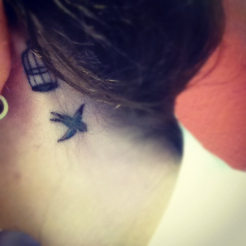 Small Bird Tattoo Behind Ear