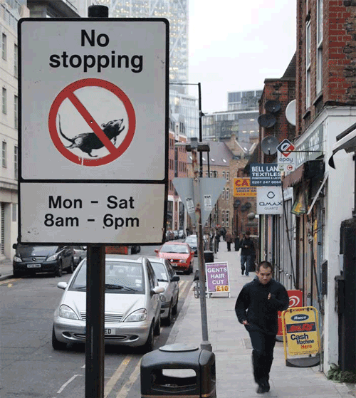 No stopping sign altered to feature a rat in an exercise wheel