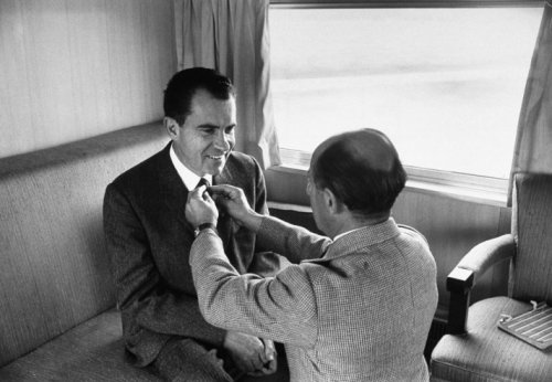 LIFE photographer Alfred Eisenstaedt adjusts Richard Nixon&#8217;s tie prior to photo shoot during the 1960 presidential campaign. Nixon lost to JFK in November of that year by one of the smallest margins in American history.
See more photos here.