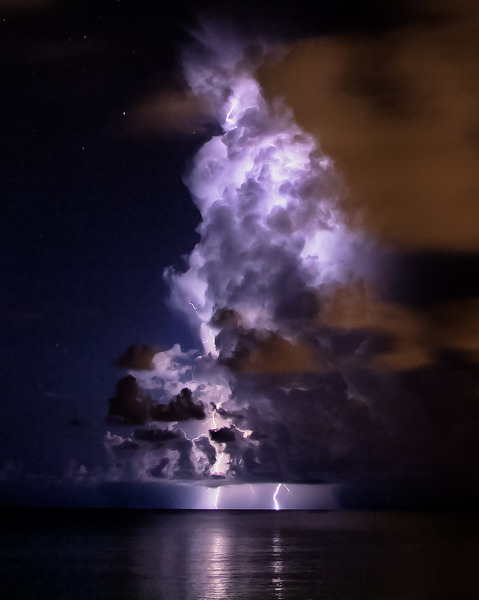 harvestheart:

Dark and Stormy - Mike Jones - a storm and nightly light show in the Caymans
