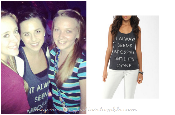 THis is the cute printed black tank top Megan is wearing in this photo.  It says Its Always Impossible Until Its Done.You can buy it HERE from Forever 21 