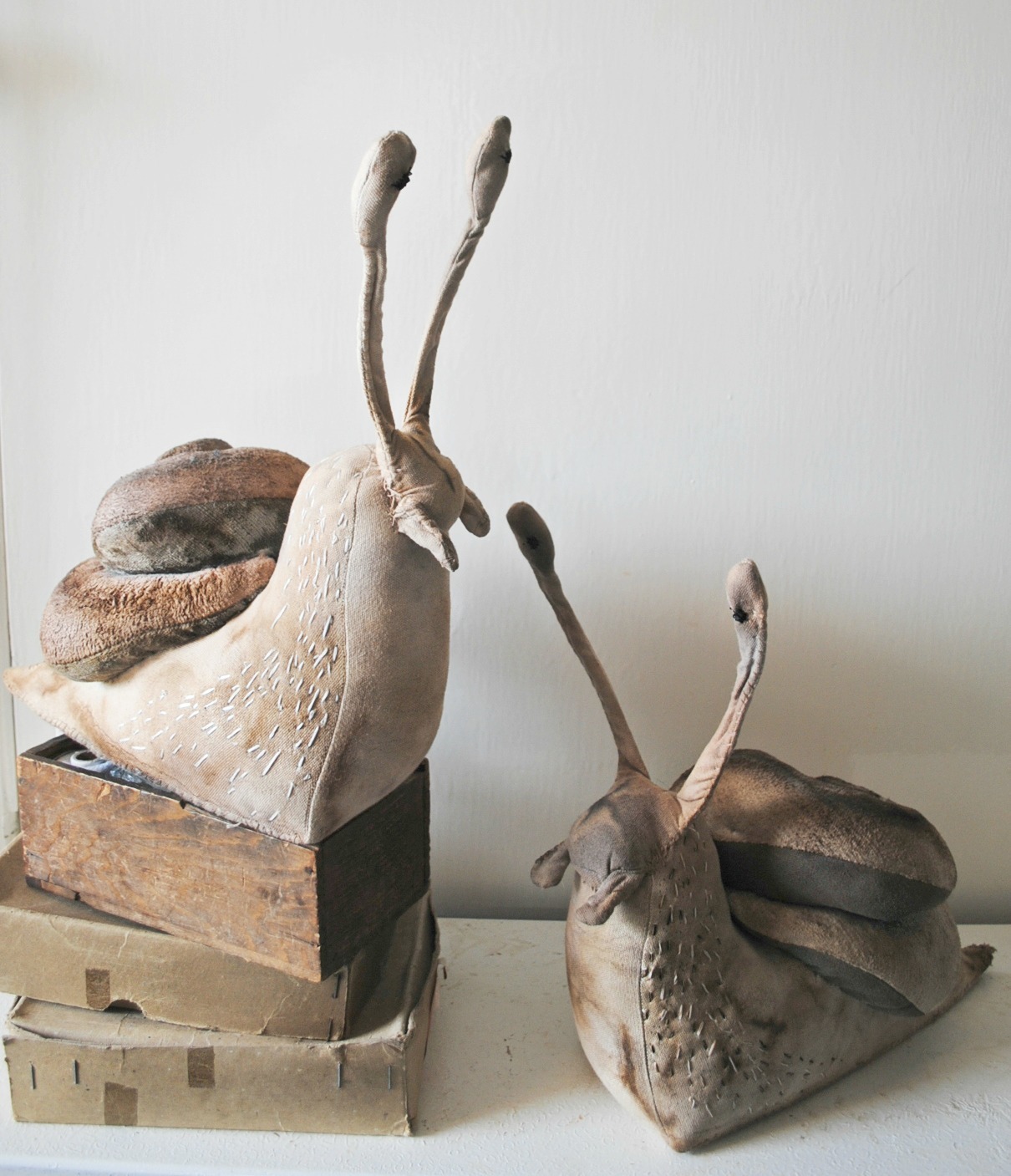 http://ohmisterfinch.tumblr.com/post/33296634921/textile-snail-sculptures-by-mister-finch