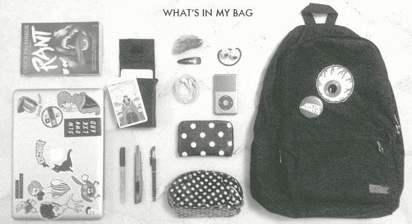 elezabeef:

What’s in my bag: Rant by Chuck Palahniuk, laptop, tarot deck, Sharpie, penknife, black pen, pouch filled with (more) bullshit, wallet, iPod, hair clip, rabbit’s foot and my eyeball hair bobble. 
What’s in your bag?