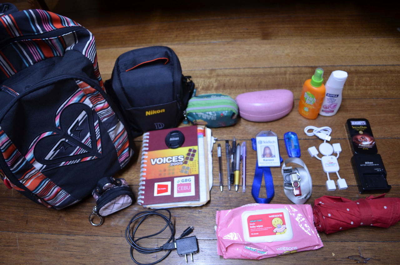Kareen&#8217;s Journal: What&#8217;s inside the bag of a cebuana traveler? charger | SLR camera | ID | journal | make up kit | sunblock | whitening lotion | USB hub | flash drive | chocolate 