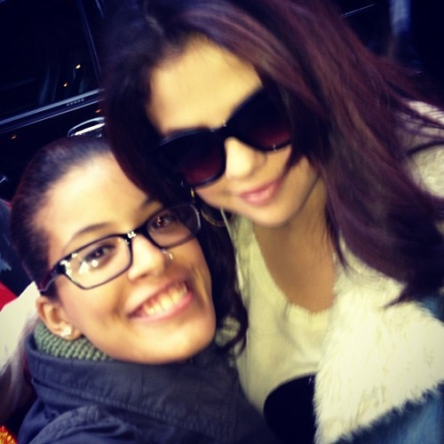 Selena with a fan.