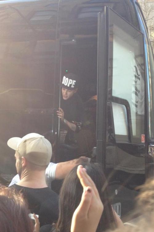 Justin in his tourbus talking to fans