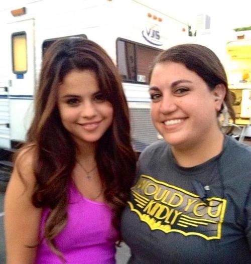 


Selena with a crew member on the set of Behaving Badly 



