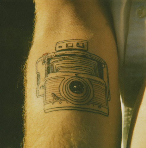 camera tattoo. Camera tattoo - press the red