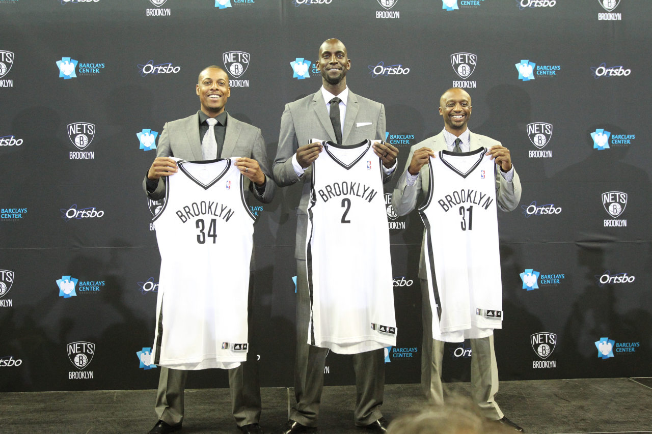 Kevin Garnett, Paul Pierce, and Jason Terry of the Brooklyn Nets pose with their new jerseys during a press conference at the Barclays Center on July 18, 2013 in the Brooklyn borough of New York City. (Photo by Nathaniel S. Butler/NBAE via Getty Images) 