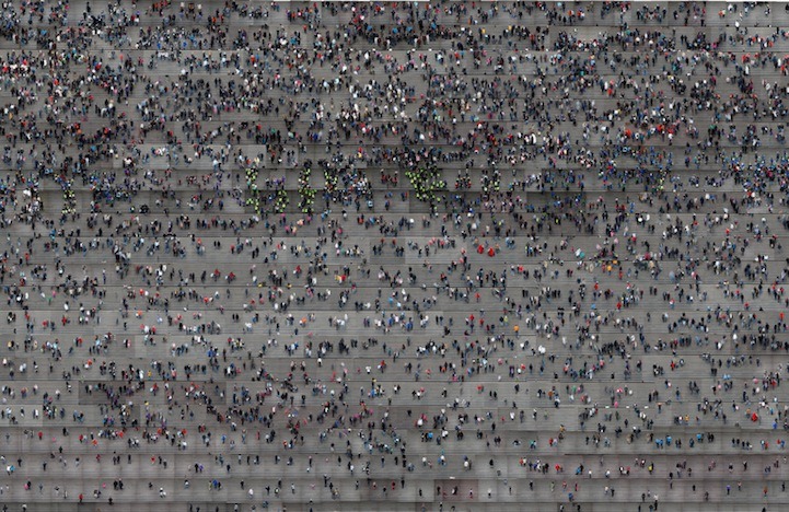 Digital Collages of People Climbing Stairs by Jiyen Lee via MMM Korean artist Jiyen Lee has created a series of hypnotizing digital collages that present people going up and down stairs, as seen from a bird&#8217;s eye view. Each puzzling assemblage features an unidentifiable traffic of pedestrians on an endless journey. It also remains unclear whether they are actually ascending or descending the steps in front of them, as Lee has taken the artistic liberty of reconfiguring images in unimaginable compositions. Like an M. C. Escher painting, the artist&#8217;s digitally manipulated images present a saturation of staircases with no perceivable beginning or end.