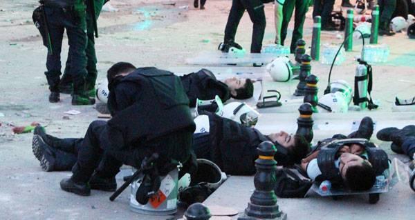 Exhausted police force takes naps on the streets of Harbiye, near Taksim.