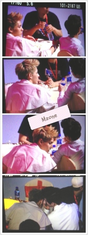 Kris poked Suho to talk to him. They where whispering to each other. | MZONE