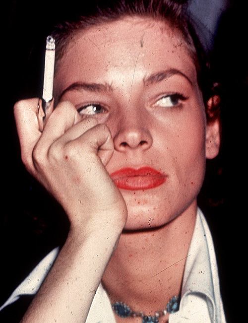 michaelpalin: Lauren Bacall smoking a cigarette on the set of Key Largo, 1948. 