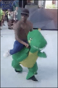 black guy dancing in dinosaur costume gif