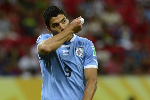 Uruguay's forward Luis Suarez celebrates after scoring against Tahiti during their FIFA Confederations Cup Brazil 2013 Group B football match, at the Pernambuco Arena in Recife on June 23, 2013.   AFP PHOTO / DANIEL GARCIA        (Photo credit should read DANIEL GARCIA/AFP/Getty Images)