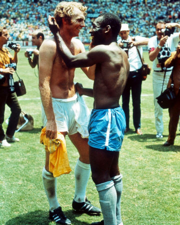 Pele and Bobby Moore (Mexico 1970)<br /><br /><br /><br />
(via profisee)” /></p><br /><br />
<p>England has some iconic moments over the history of the World Cup. There’s Gazza’s tears, Beckham’s many haircuts, 1966 and the hand of god. Two icons from their most successful era were the goalkeeper Gordon Banks and their much loved gentlemanly captain Bobby Moore.</p><br /><br />
<p>Banks was all things to all English football fans. The English number 1 won the World Cup with England in 1966, starred for Leicester City and Stoke along with getting an OBE. One his greatest moments and possibly the greatest save ever seen in a World Cup game in the heat of Mexico in 1970. Moore meanwhile had captained England in 1966 and was still a colossus when 1970 rolled around but had his lead up to the tournament blighted when he was put under house arrest in Bogota for four days for allegedly stealing a bracelet with the charges eventually thrown out. The football orientated student punk band ‘Serious Drinking’ even wrote song about the incident called <em>Bobby Moore is innocent.</em></p><br /><br />
<p>England went to the 1970 World Cup as champions and one of the favourites to go back to back. The trouble was they were drawn with Brazil who was equally if not better than them and looking to make history themselves as the first three time winner. In the first match England did away with Romania 1-0 and then had Brazil lined up at the Estadio Julisco in Guadalajara. In the first 10 minutes the Brazilians seemed to have an extra player on the field and bamboozled the English with their speed and skill.</p><br /><br />
<p>After 10 minutes the captain Carlos Alberto sent a pass for Jarzinho to run on to. Jarzinho made the left back for England Cooper look ordinary and sent a brilliant cross over to the far post where Pele and lurking. Pele dived over his minder and headed the ball like a bullet down low and to the right of Banks and yelled ‘GOLO!!!’ as he headed the ball such was his assumption that he was going to score. What he didn’t count on was Banks being able to get across from post to post and tip the ball away and out for a corner with his diving right hand.</p><br /><br />
<p><img259