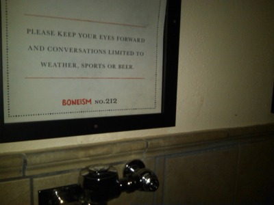 Bathroom sign above urinal.  BBQ restaurant.<br />
(Virginia Beach, VA)