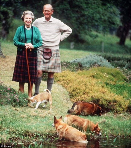 Queen Elizabeth II and Prince Philip with their corgis at Balmoral, 1994.