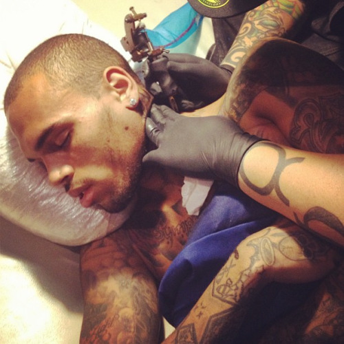  Chris sleeping while getting a new tattoo! 