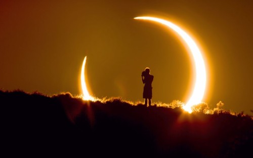 inothernews:

An observer is seen during a partial solar eclipse...