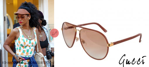 Rihanna seen shopping with girlfriends out in Italy, wearing tan Gucci aviator sunglasses. For the occasion, she ended up changing out of her Topshop platforms to white heels by Prada while carrying a white Chanel crochet leather fringe bag.

Rihanna&#8217;s jewelry consists of a cameo snake ring by Amedeo, yet we&#8217;re still searching for specific information on her gold chain she wore around her neck.
