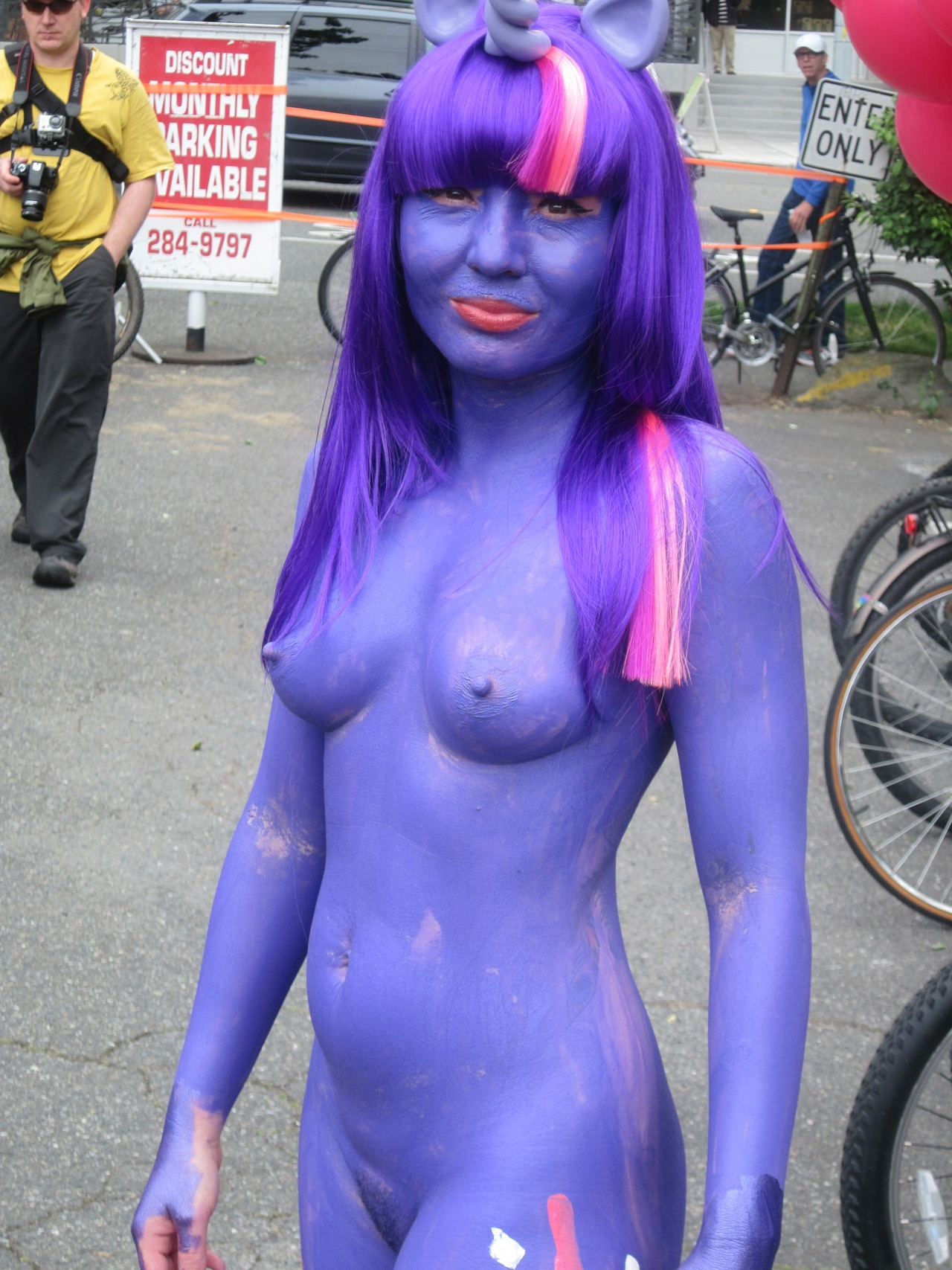 Nude public body painting